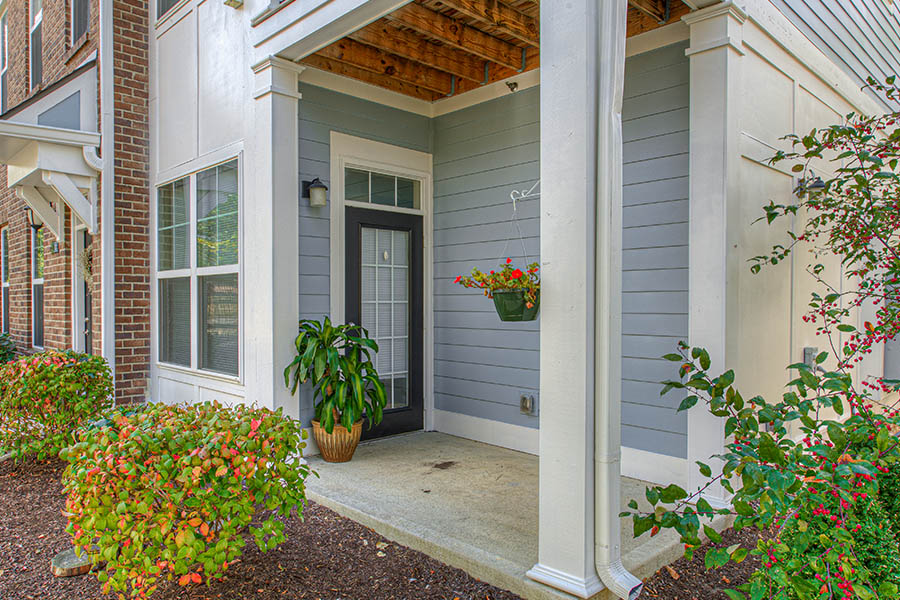 Porch with potted plants located at Union Flats Apartments.